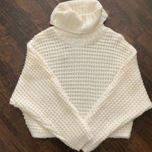 Cream colored sweater.